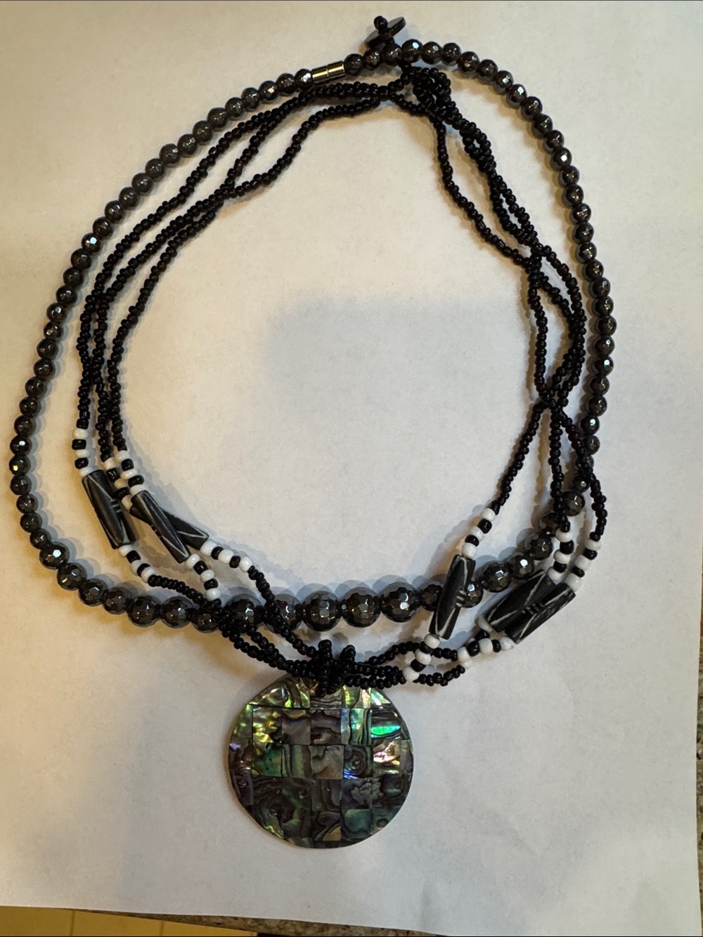 Set-Multi-Strand Black Beaded Necklace with Abalone Pendant & Hematite Necklace.